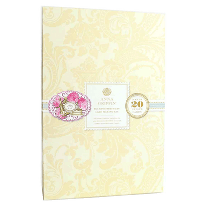 a wedding album with a pink flower on it.