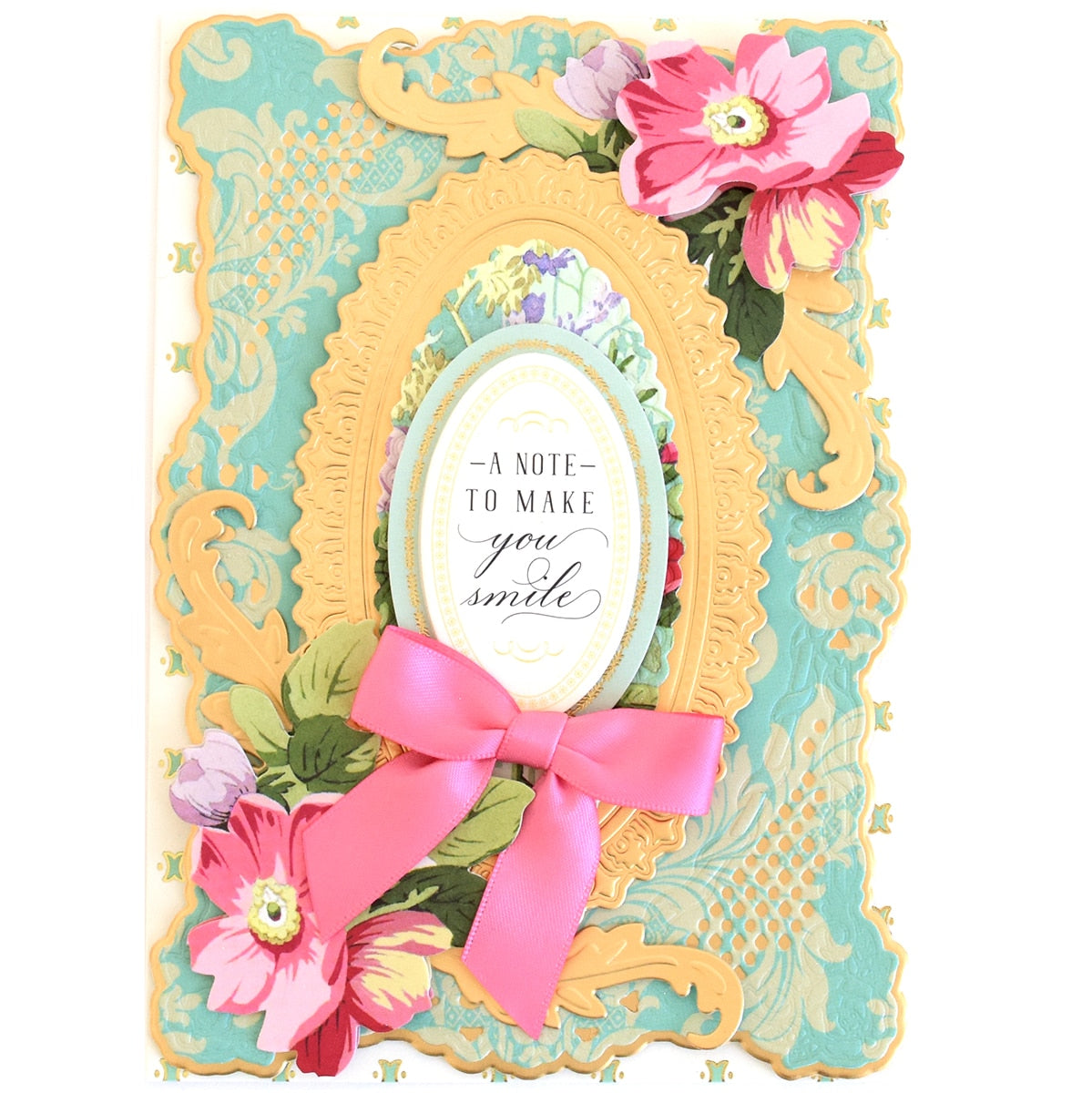 a card with a pink bow and a picture frame.