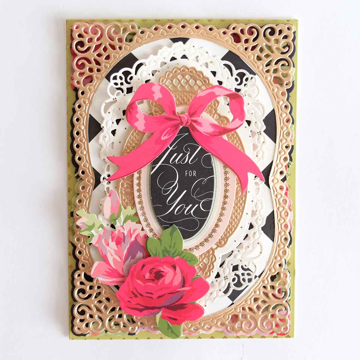 a card with a pink rose on it.