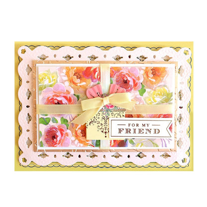 a card with flowers and a ribbon on it.