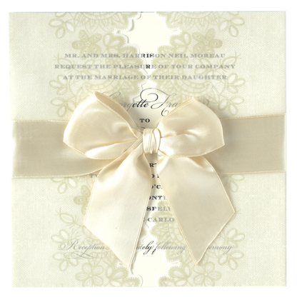 a wedding card with a bow on it.
