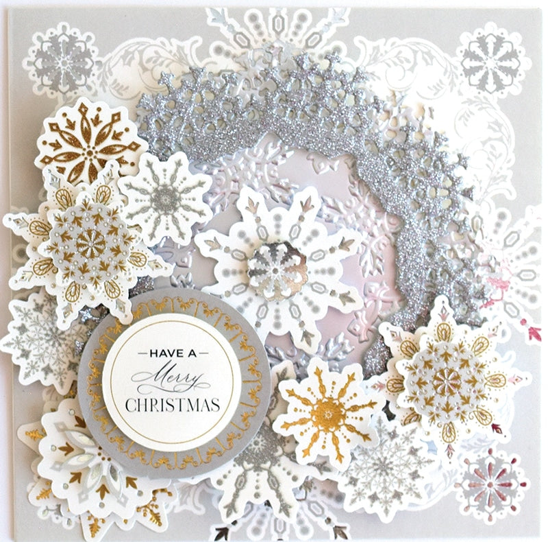 a christmas card with snowflakes and a card saying have a merry christmas.