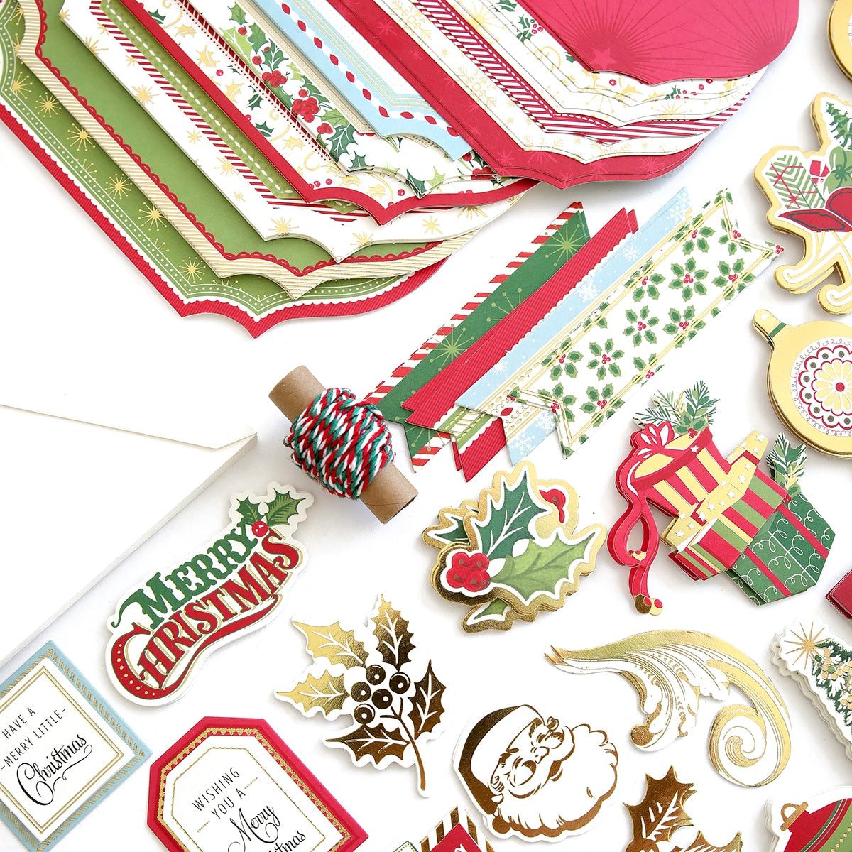 a pile of christmas themed paper and stickers.