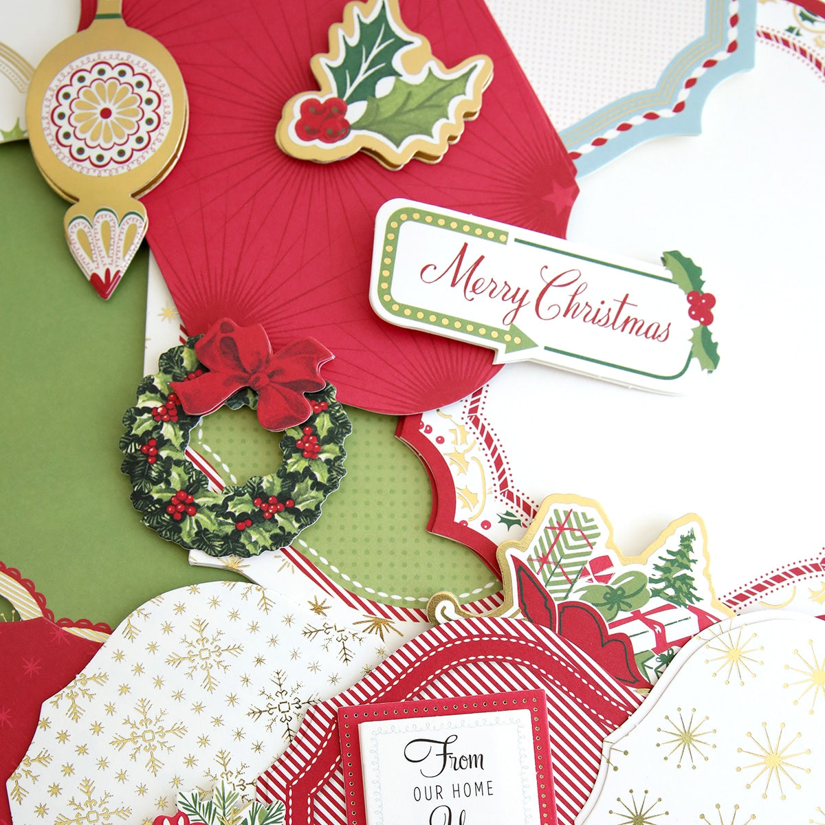 a close up of a christmas card with a wreath.