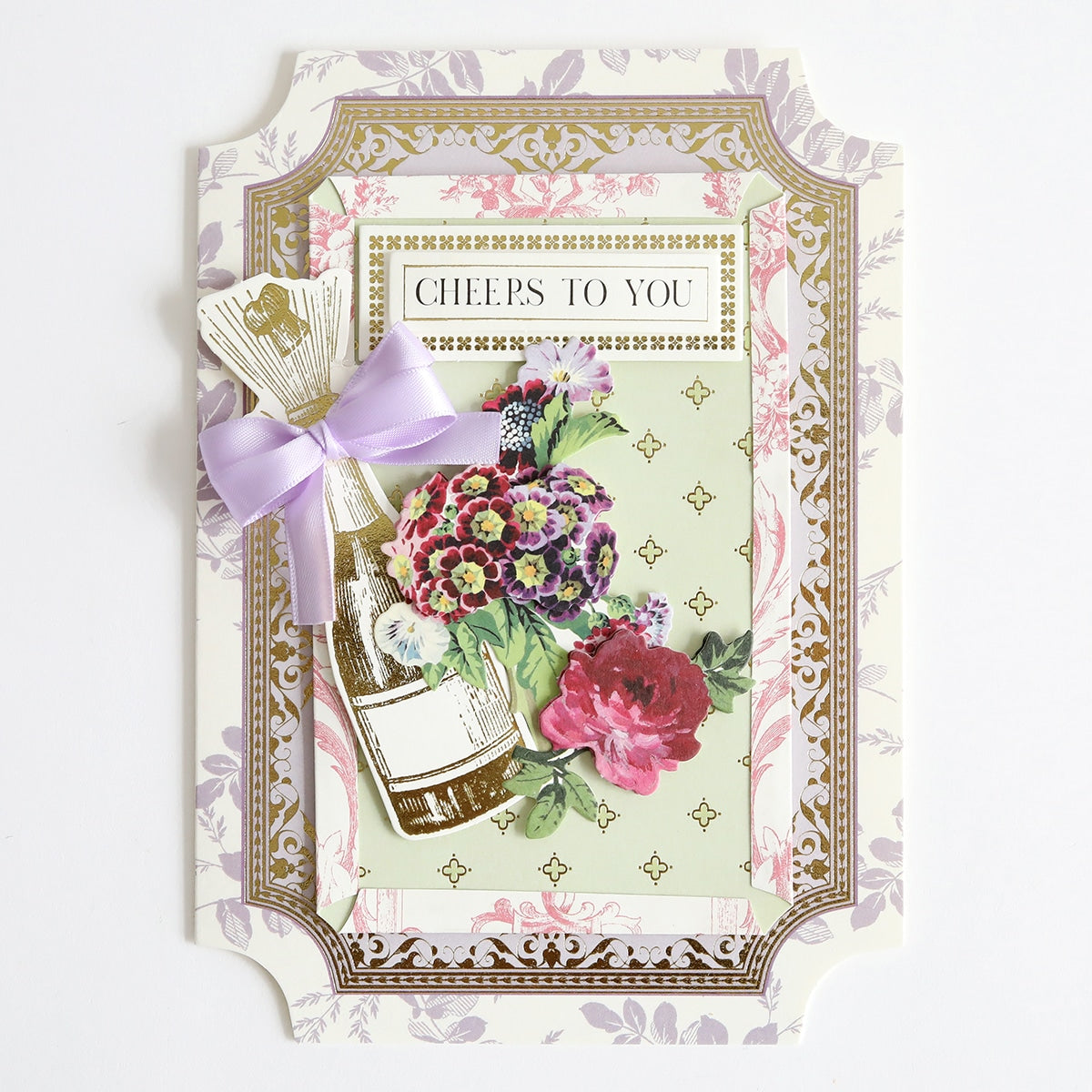 a card with a bottle of wine and flowers on it.