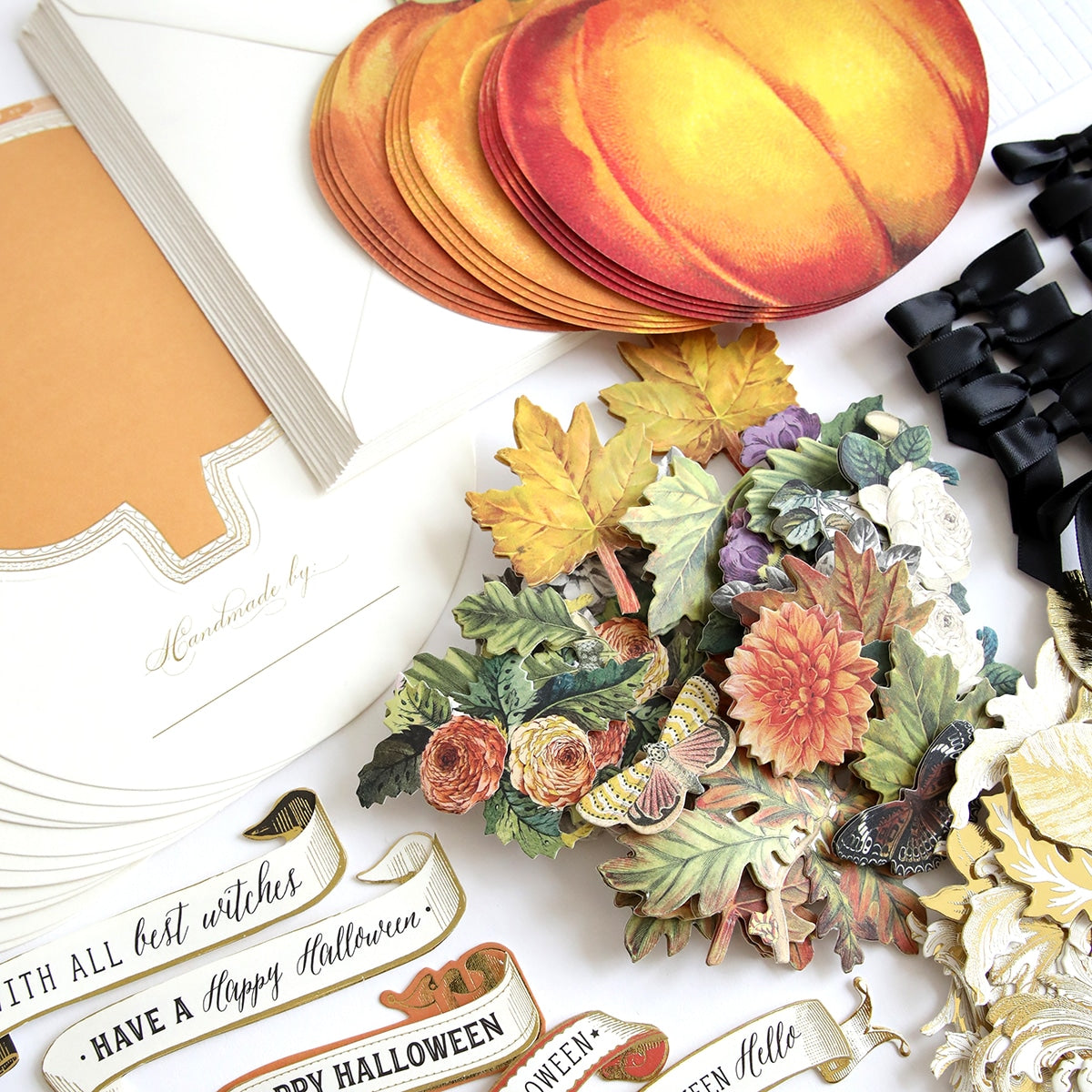 A collection of Simply Rocking Pumpkin Card Making Kit and embellishments for a Halloween party.