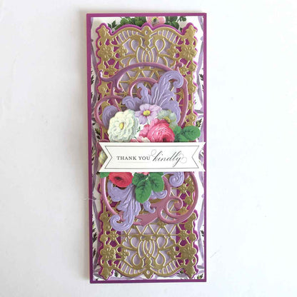 a purple and gold card with flowers on it.