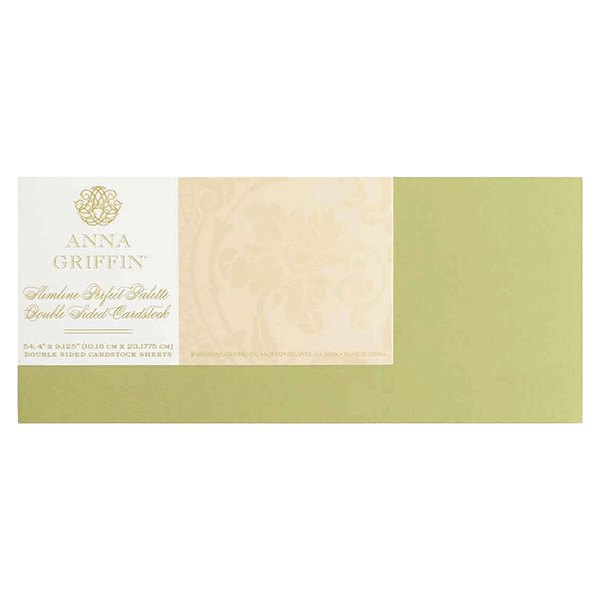 a green and white envelope with a gold foil stamp.