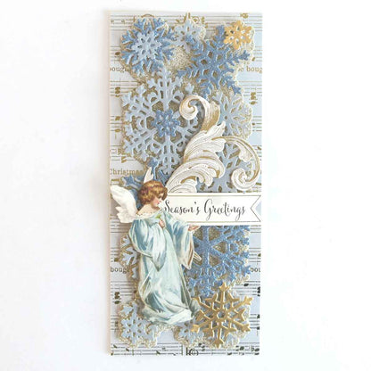 a card with an angel and snowflakes on it.