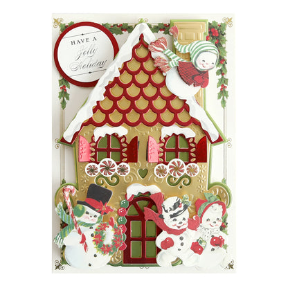 A Christmas card with a gingerbread house and Snow People Sticker Bundle.
