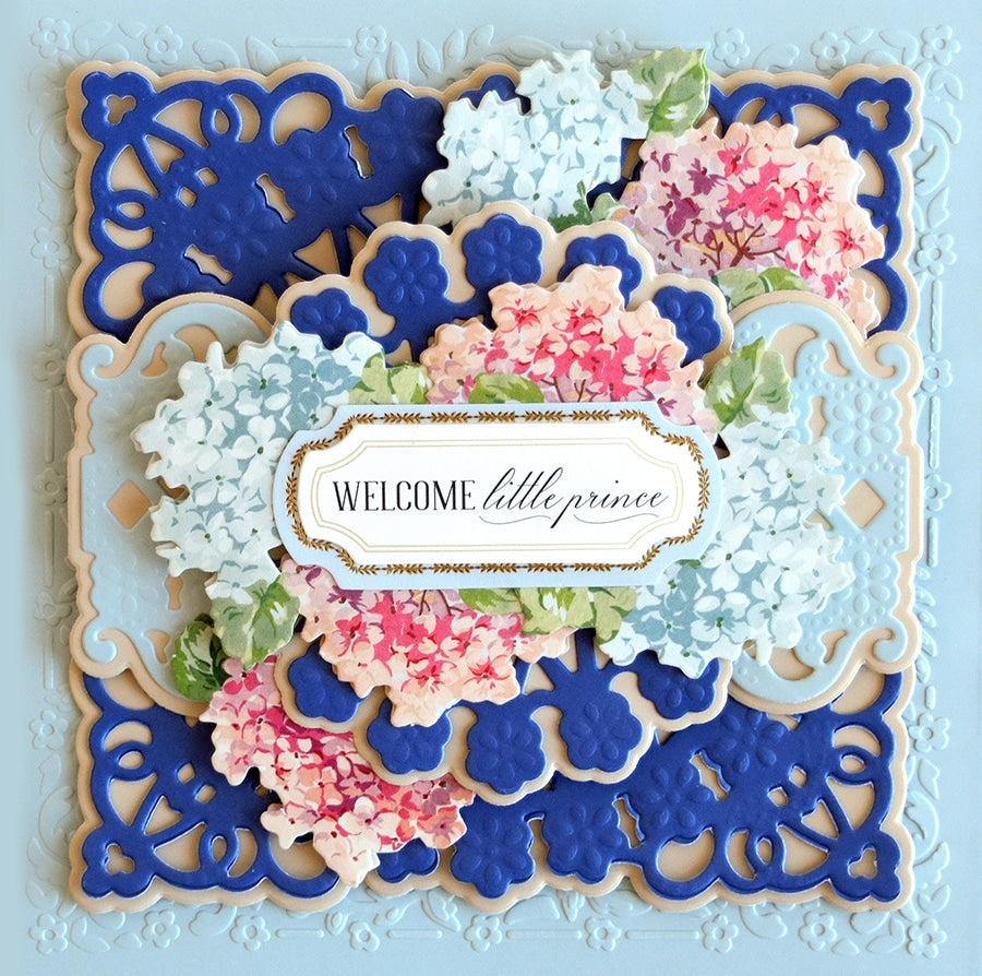 a blue and white card with flowers on it.