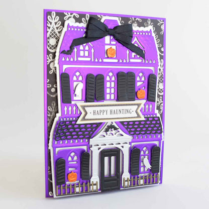 a purple house with a black bow on it.