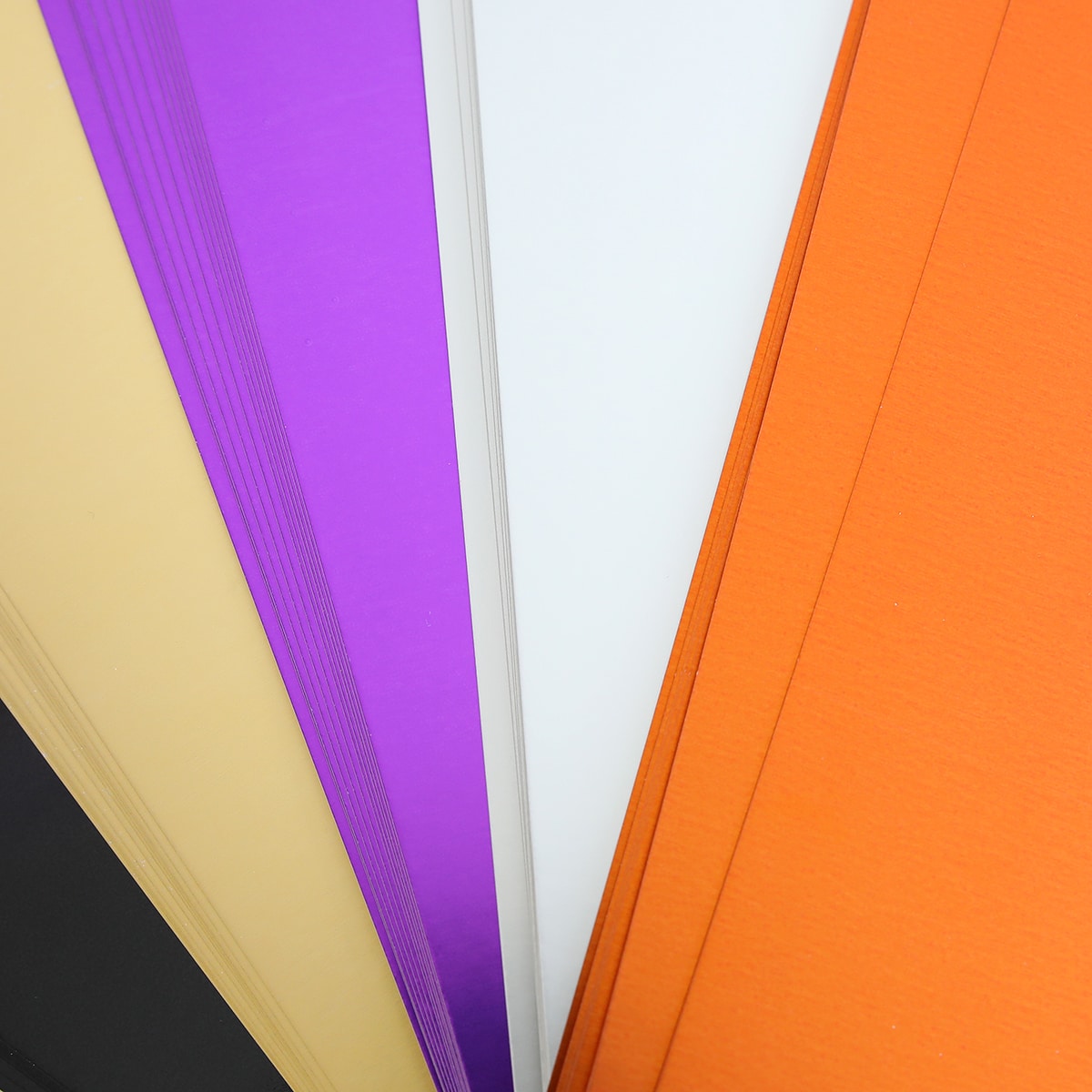 a close up of a bunch of different colors of paper.