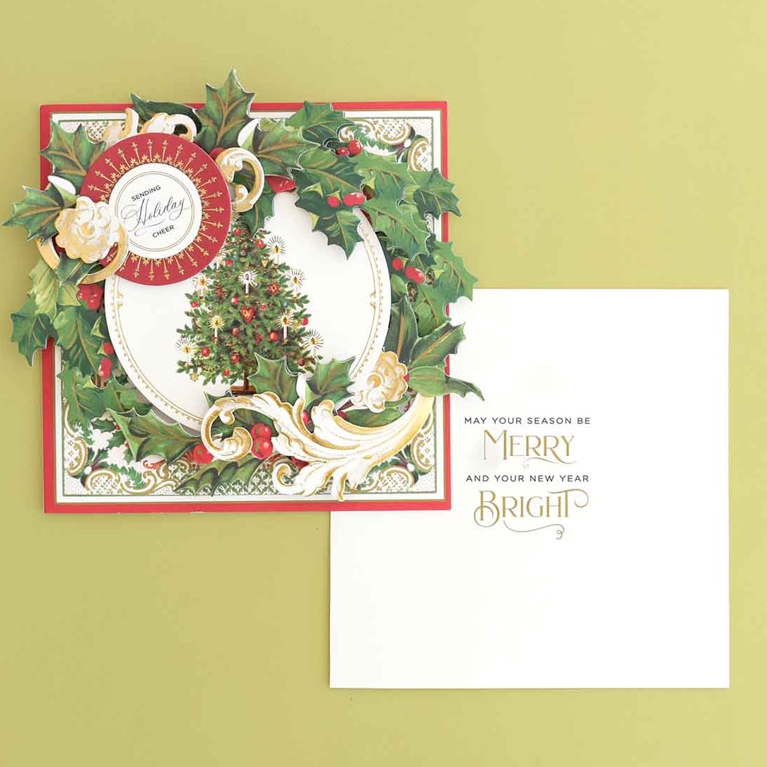 a christmas card with a holly tree on it.