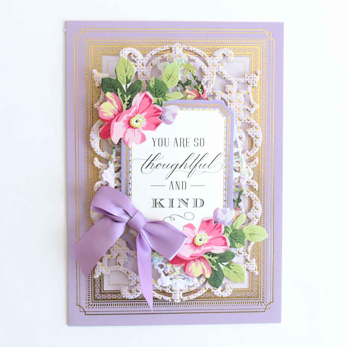 a card with a purple ribbon and a card saying you are so beautiful and kind.
