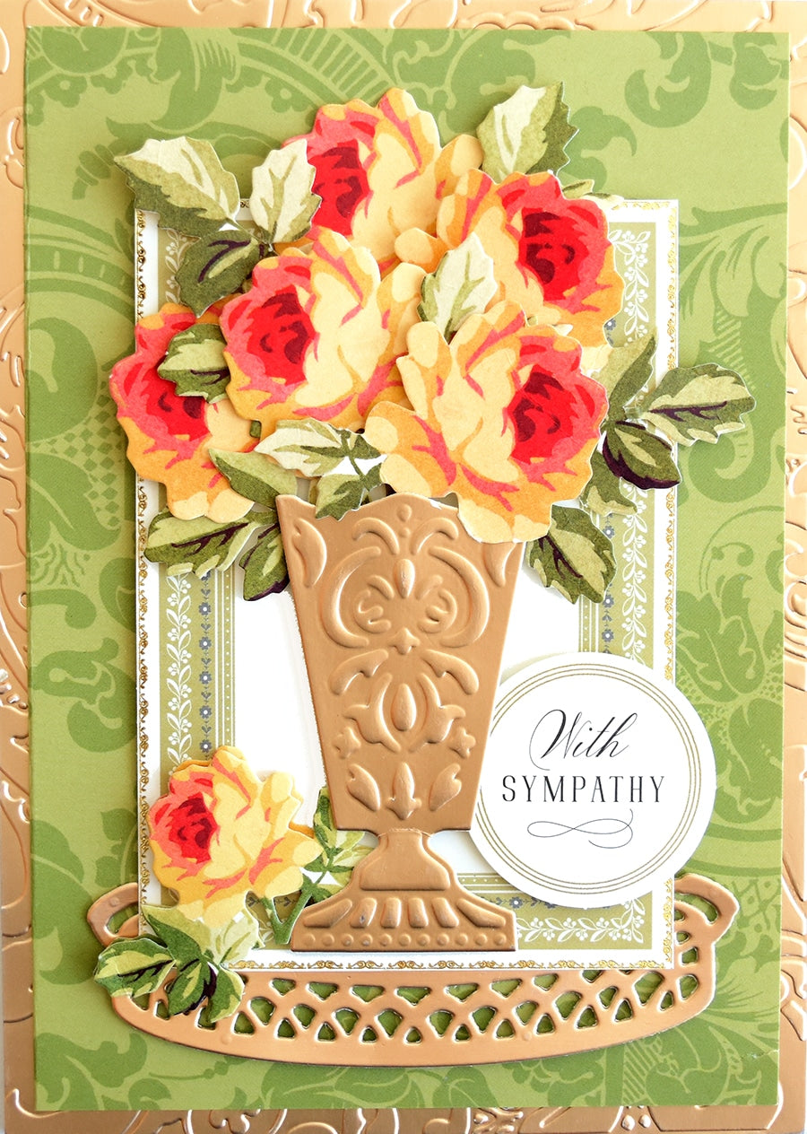 a close up of a card with a vase of flowers.