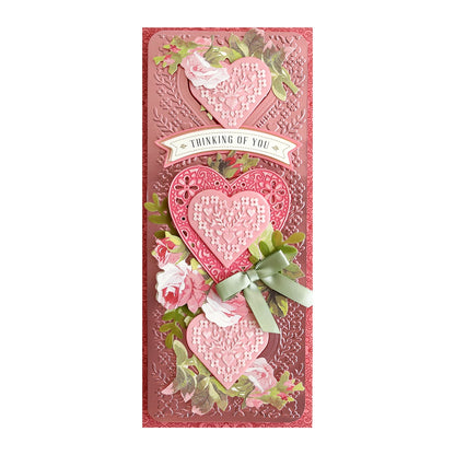 a pink card with two hearts and a ribbon.