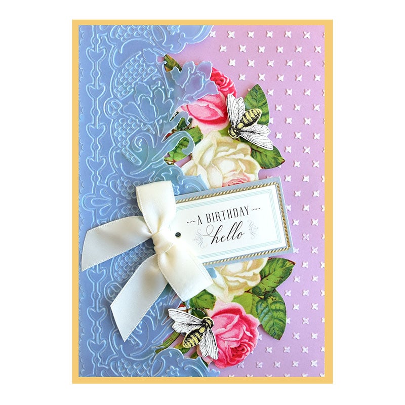 a birthday card with flowers and a ribbon.
