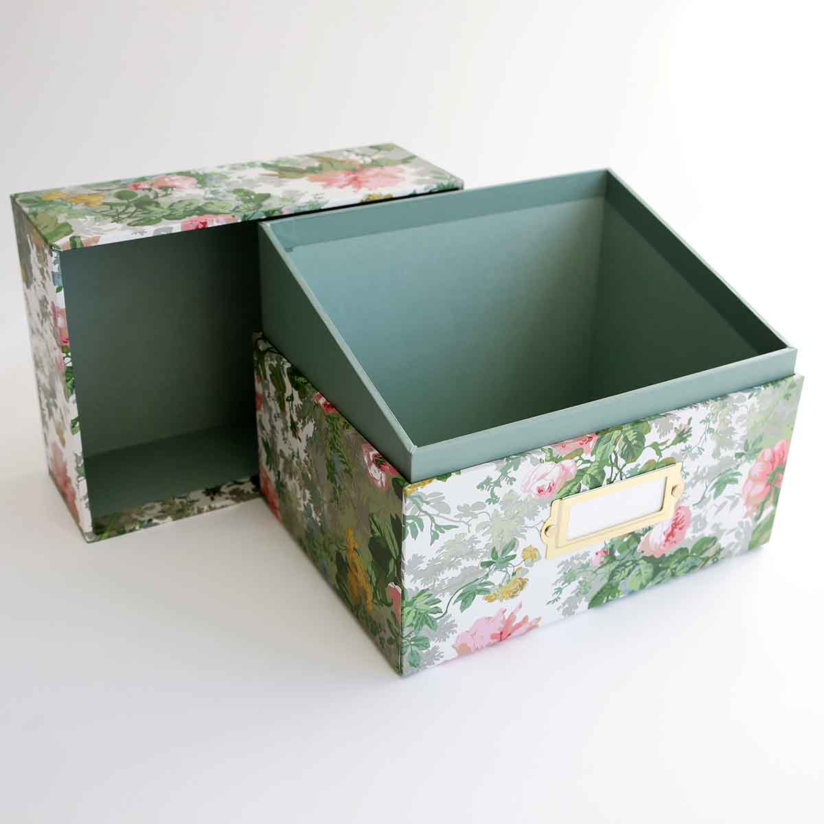 a pair of boxes with floral designs on them.