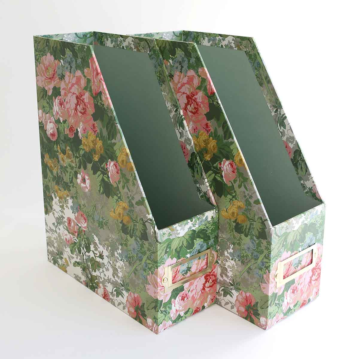 a pair of boxes with floral designs on them.