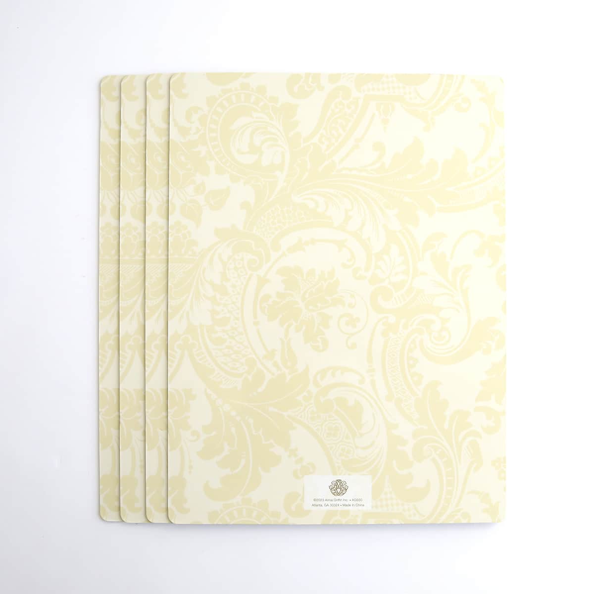 a set of four yellow notebooks with a white background.