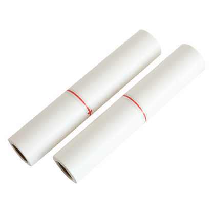 two rolls of white paper with red string.