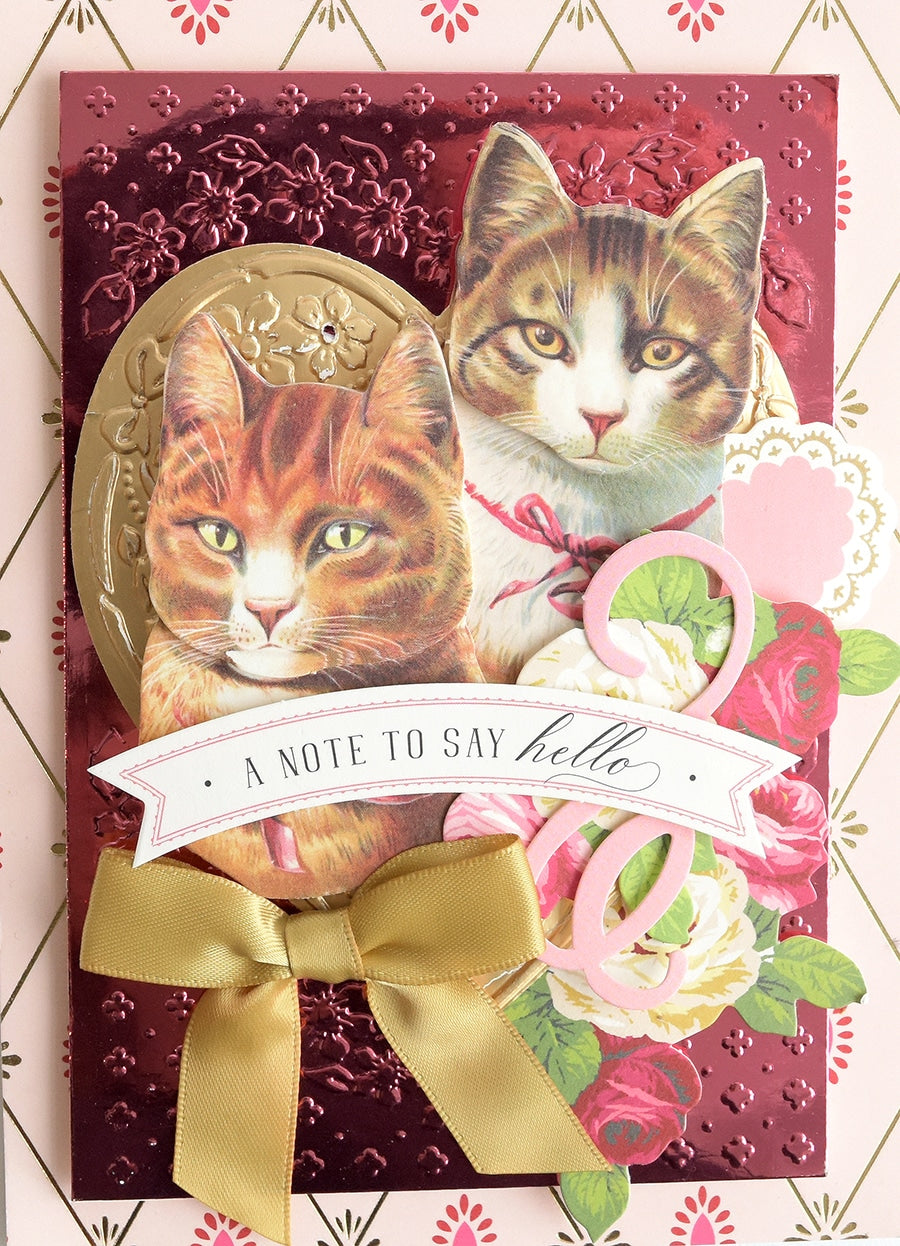 a close up of a card with two cats.