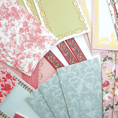 a bunch of different types of paper on a table.