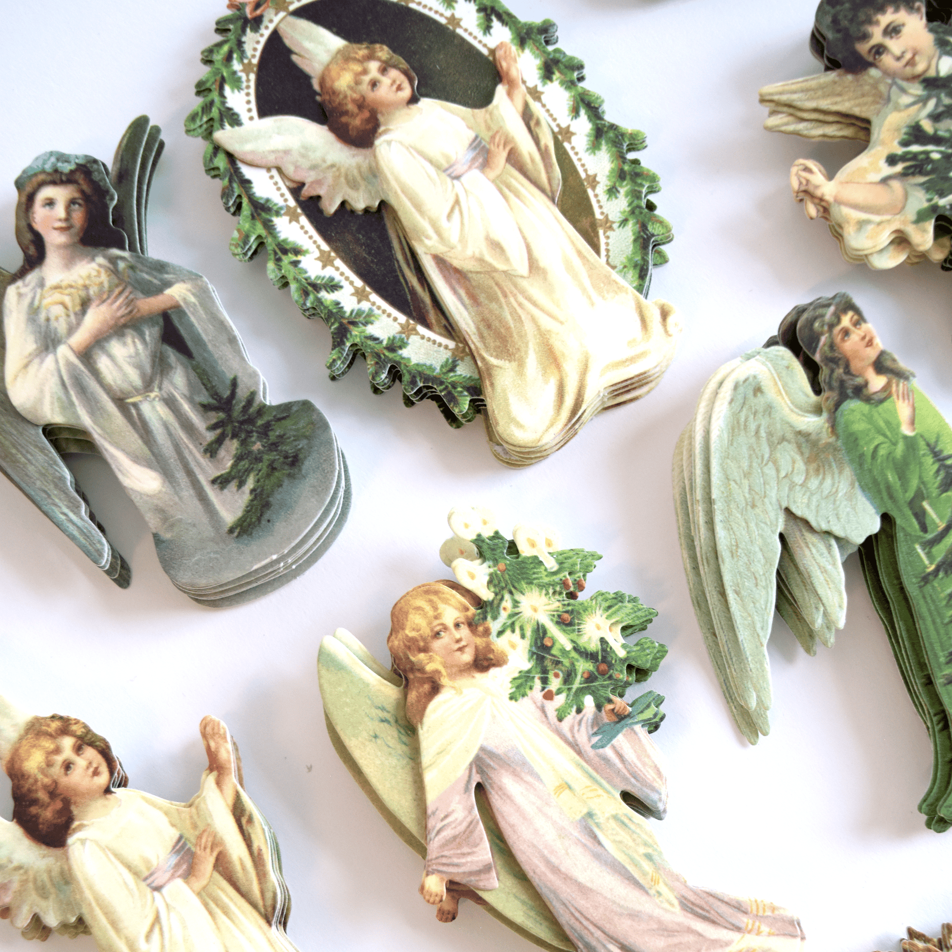 a group of angel figurines sitting on top of a table.
