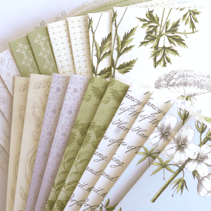 a bunch of papers that have flowers on them.